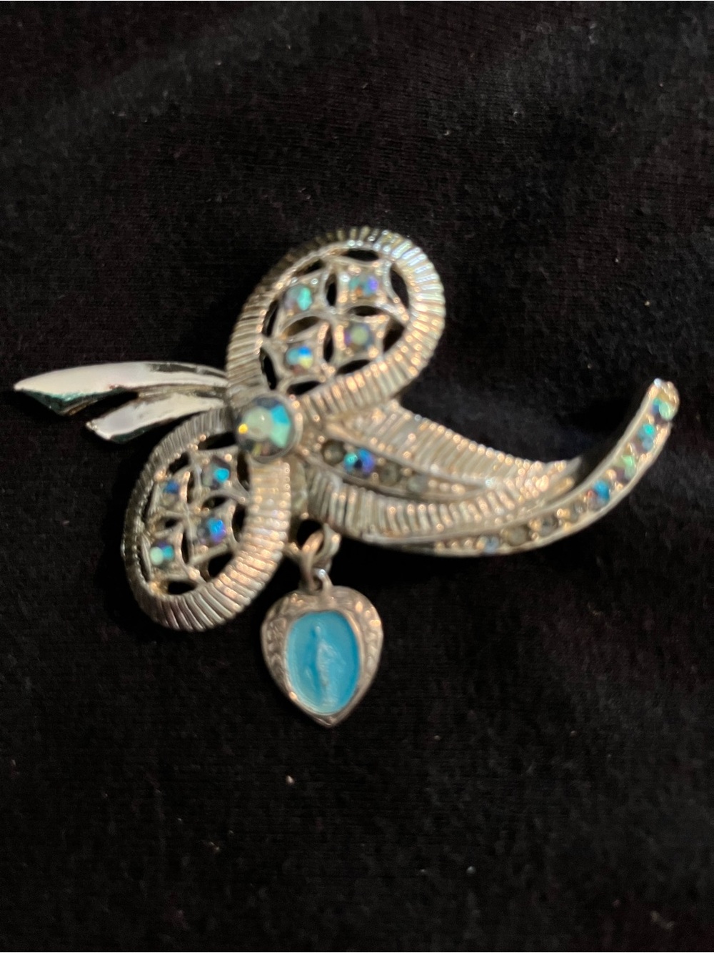 Silver-Tone Bow Virgin Mary Brooch with Blue Aurora Stones